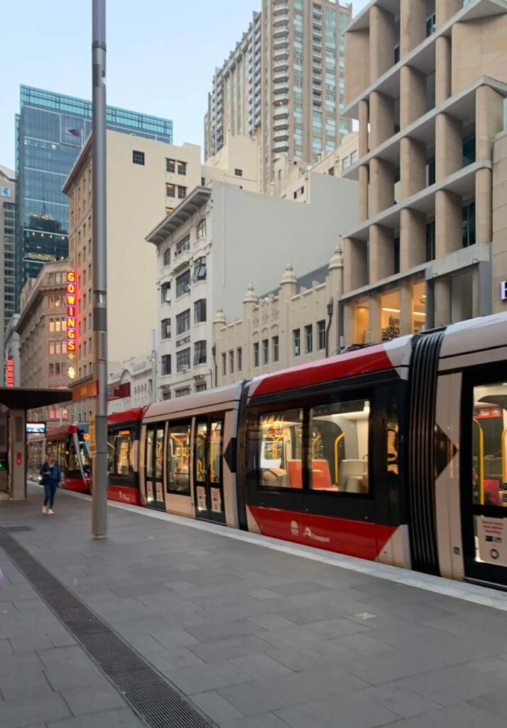 Modern streetcar in an urban cityscape with buildings in the background Transit-Oriented Development