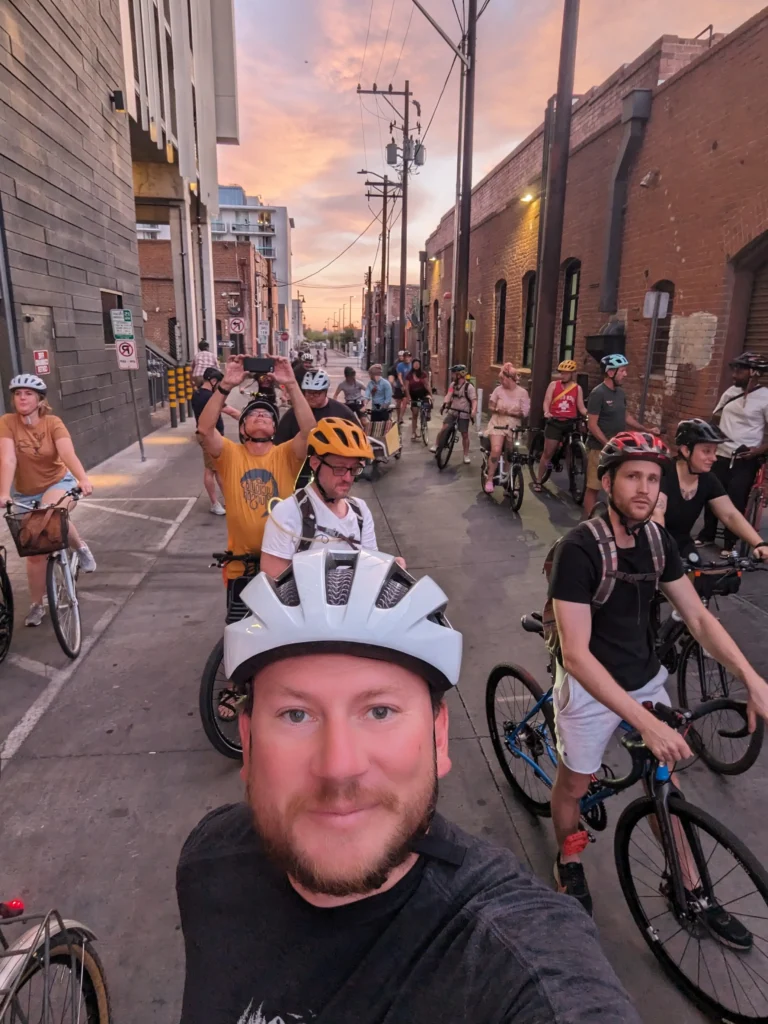 Car-Free Tucson and friends biking at sunset